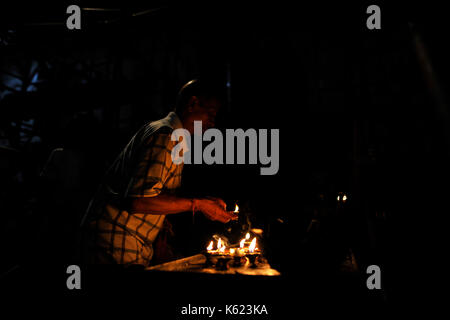 Kathmandu, Nepal. 10th Sep, 2017. Nepalese devotees offering oil lamps on the last day of Indra Jatra Festival celebrated in Basantapur Durbar Square, Kathmandu, Nepal on Sunday, September 11, 2017. Devotees celebrated the god of rain 'Indra' for 8 days in Kathmandu. Credit: Narayan Maharjan/Pacific Press/Alamy Live News Stock Photo