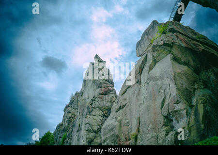 Beautiful rocky landscape with unique Mystic rock formation in a dramatic sky. Stock Photo