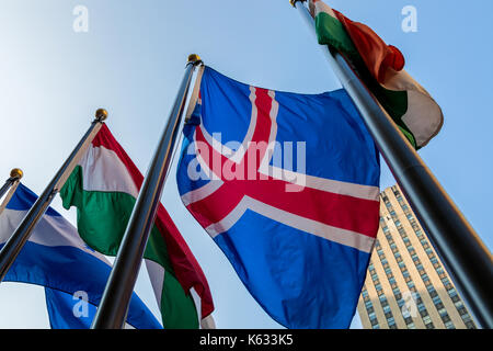 A flag of Iceland along with other fly at the Rockefeller Center in New York City, New York. Stock Photo