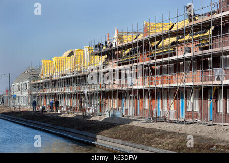 Residential construction site with some workers in Berkel in the Netherlands Stock Photo