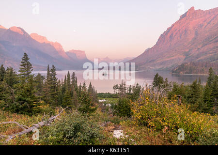 Sunrise over St Mary's Lake in Glacier National Park, Montana, USA.  Goose island is visible alone in the middle of the lake. Stock Photo