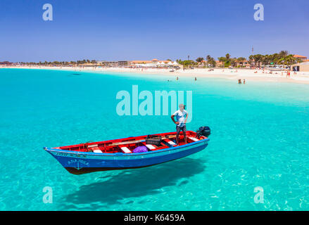 CAPE VERDE SAL Fisherman bringing his catch of fish in a decorated fishing boat to the pier at Santa Maria, Sal island , Cape Verde islands, Africa Stock Photo