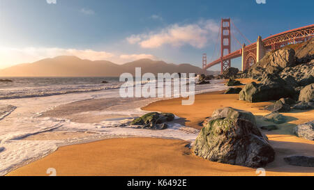 Golden Gate Bridge from the beach in San Francisco at sunset. Stock Photo