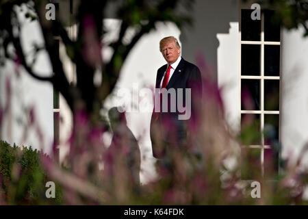 Washington, USA. 11th Sep, 2017. U.S. President Donald Trump walks toward Oval Office of the White House after leading a moment of silence in remembrance of those lost during the September 11, 2001 terrorist attacks, in Washington, DC, U.S., on Monday, Sept. 11, 2017. Trump is presiding over his first 9/11 commemoration on the 16th anniversary of the terrorist attacks that killed nearly 3,000 people when hijackers flew commercial airplanes into New Yorkís World Trade Center, the Pentagon and a field near Shanksville, Pennsylvania. Credit: MediaPunch Inc/Alamy Live News Stock Photo