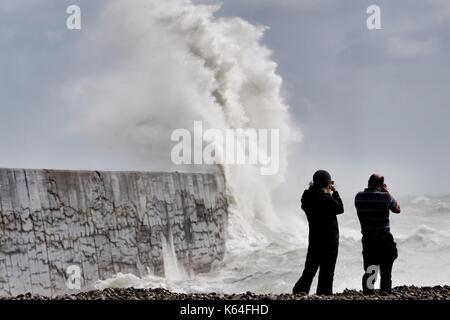 Newhaven, East Sussex. 11th September 2017 People taking risks to watch massive waves battering Newhaven breakwater in East Sussex as strong winds sweep along the Sussex coast.  East Sussex. © Peter Cripps/Alamy Live News Stock Photo