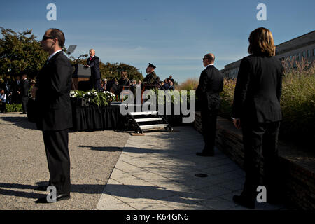 United States Secret Service personnel stand watch while U.S. President Donald J. Trump, center left, speaks during a ceremony to commemorate the September 11, 2001 terrorist attacks, at the Pentagon in Washington, D.C., U.S., on Monday, Sept. 11, 2017. Trump is presiding over his first 9/11 commemoration on the 16th anniversary of the terrorist attacks that killed nearly 3,000 people when hijackers flew commercial airplanes into New York's World Trade Center, the Pentagon and a field near Shanksville, Pennsylvania.  Credit: Andrew Harrer / Pool via CNP /MediaPunch Stock Photo