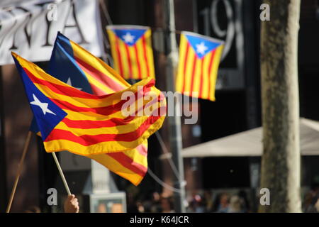Barcelona, Spain. 11th Sep, 2017. People participating with Catalan independentist symbols at the Diada, the national day of Catalonia. Credit: Dino Geromella/Alamy Live News Stock Photo