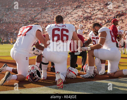 Los Angeles, CA, USA. 09th Sep, 2017. Stanford defensive lineman (66) Harrison Phillips and some of his teammates pray before the Stanford Cardinal vs USC Trojans football game on Saturday, September 9, 2017 at the Los Angeles Memorial Coliseum in Los Angeles, California. USC defeated Stanford 42-24. (Mandatory Credit: Juan Lainez/MarinMedia.org/Cal Sport Media) (Complete photographer, and credit required) Credit: csm/Alamy Live News Stock Photo