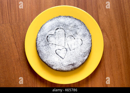 Cocoa cake with velvety sugar hearts Stock Photo