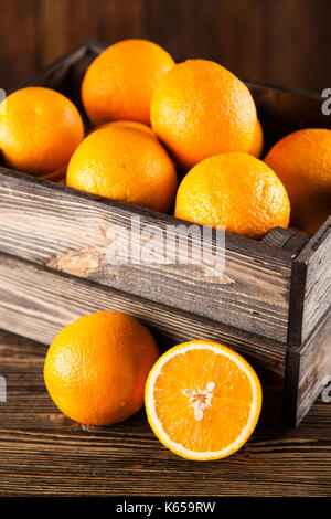 Fresh oranges in a crate Stock Photo