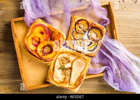 Baked fruit sweet pie slices on a tray Stock Photo