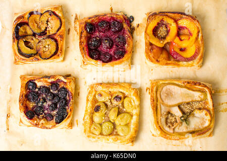 Baked fruit sweet pie slices on a tray Stock Photo