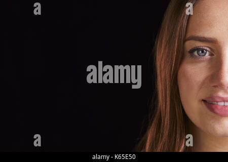 Cropped Head And Shoulders Studio Portrait Of Smiling Woman Stock Photo