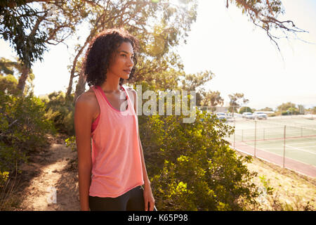 Young black woman taking a break during her run Stock Photo