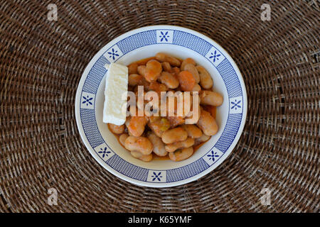 Gigantes giant beans with carrots and feta cheese. Greek food. Stock Photo