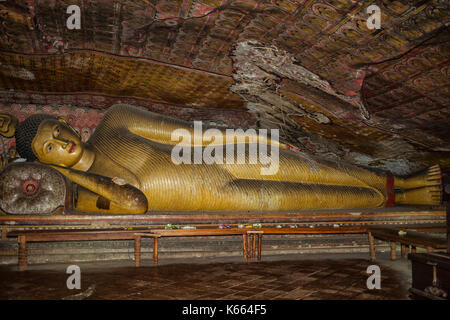 Reclining Buddha in the best preserved and largest cave complex in the country and a UNESCO site. Hundreds of Buddhas are found in the series of caves Stock Photo