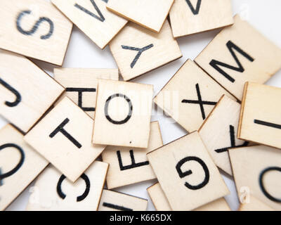 A macro image of a messy pile of wooden letters. Stock Photo
