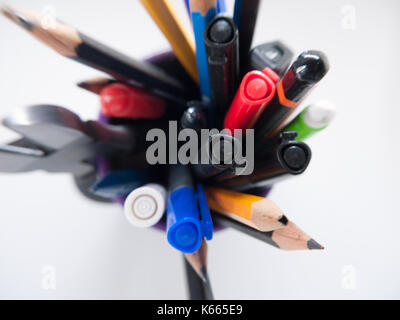 A pot containing stationary items such as pens and pencils, Stock Photo