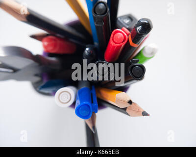 A pot containing stationary items such as pens and pencils, Stock Photo