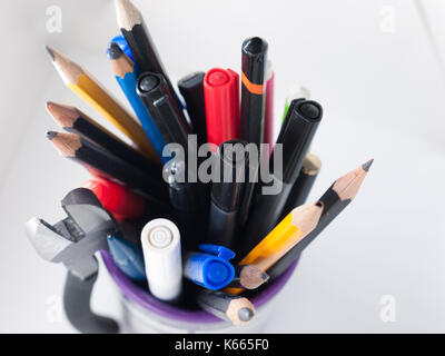 A pot containing stationary items such as pens and pencils, Stock Photo