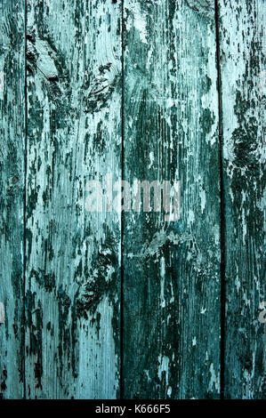 Vertically located colored background boards, painted with blue paint, old fence. Stock Photo