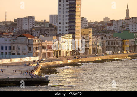 People gather on Havana's malecon at sunset. Havana, Cuba. Stock Photo