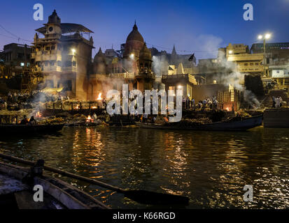 VARANASI, INDIA - CIRCA NOVEMBER 2016: Cremation in progess at the Manikarnika Ghat. This is is one of the oldest ghats in Varanasi, and most known fo Stock Photo