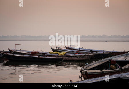 VARANASI, INDIA - CIRCA NOVEMBER 2016: Boats on the Ganges river early morning. The city of Varanasi is the spiritual capital of India, it is the holi Stock Photo