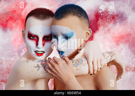 Futuristic geishas hugging Stock Photo