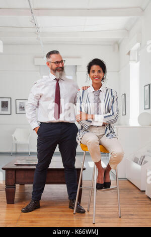 Portrait of a smiling businessman and businesswoman Stock Photo