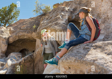 Portrait of Caucasian grandmother and granddaughter playing on rock Stock Photo