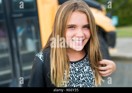 Elementary school pupil outside carrying rucksack Stock Photo