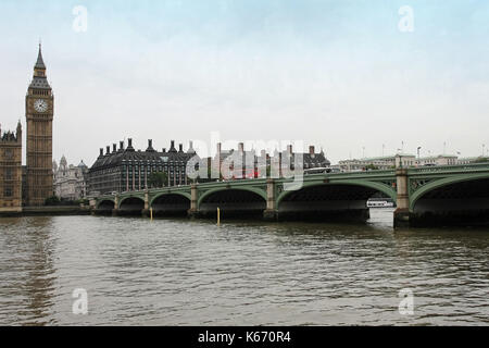 LONDON, UNITED KINGDOM - JULY 31: Westminster bridge with Big Ben on side during cloudy day in London, UK - July 31, 2008; Busy Westminster bridge wit