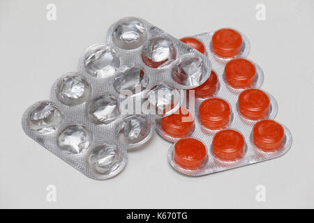 Medical lozenges healing sore throat in plastic blisters Stock Photo