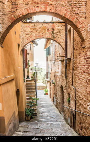 Beautiful narrow street in Montepulciano in Tuscany Italy. Montpulciano is famous for its wine. Stock Photo