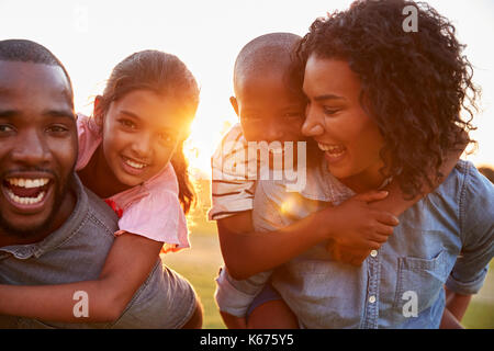 Young black couple enjoying family time with children Stock Photo