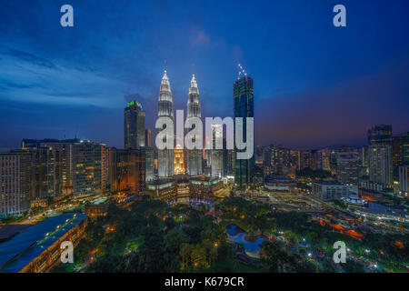 City skyline with Petronas Twin Towers at sunset, Kuala Lumpur, Malaysia Stock Photo