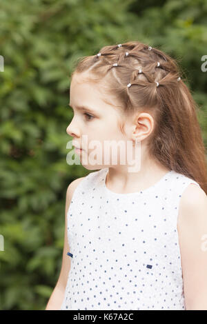 Portrait of a girl with an ornate hairstyle Stock Photo