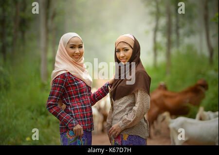 Portrait of two smiling women wearing traditional hijabs Stock Photo