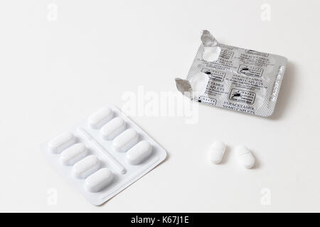 Pain killers: open blister pack of paracetamol pills or tablets with two paracetamol 500 mg caplets removed. Stock Photo
