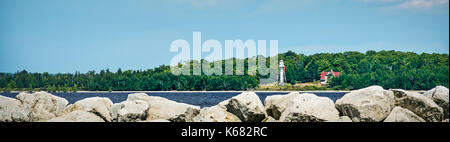 An island lighthouse as viewed from the Wisconsin mainland. Stock Photo