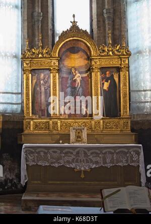 Venice Veneto Italy. Basilica Santa Maria Gloriosa dei Frari (I Frari). Sacristy, triptych Madonna with child 1488 by Giovanni Bellini 1433-1516.. Stock Photo