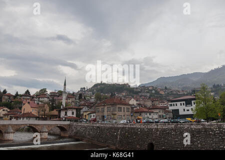 SARAJEVO, BOSNIA AND HERZEGOVINA - APRIL 15, 2017: Panorama of the left bank of Sarajevo, in the old part of the city, during a cloudy and rainy after Stock Photo