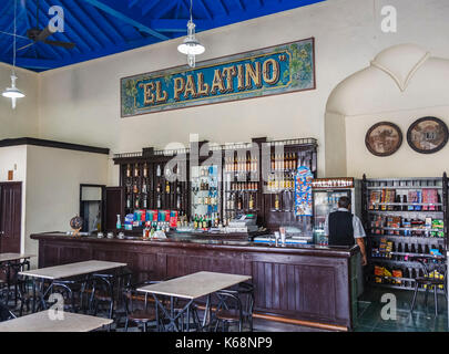 Interior of El Palatino restaurant, café and bar well-stocked with bottles of rum and spirits, in downtown Cienfuegos, a city on south coast of Cuba Stock Photo
