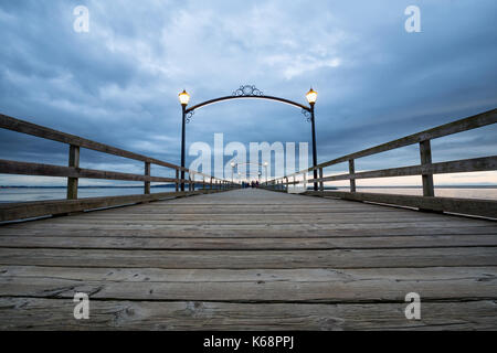 White Rock Pier Walk during a cloudy sunset. Picture taken in Vancouver Lower Mainland, BC, Canada. Stock Photo