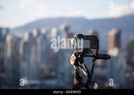 Downtown Vancouver, BC, Canada - Apr 02, 2017 - Sonny Camera A6000 taking a timelapse of the City during Sunset. Stock Photo