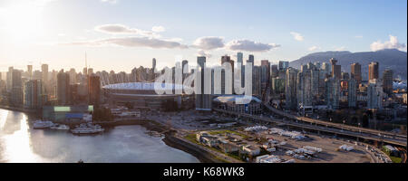 Downtown Vancouver, BC, Canada - Apr 02, 2017 - Aerial Panoramic View of the City Skyline, BC Place Stadium, Rogers Arena, around False Creek during a Stock Photo