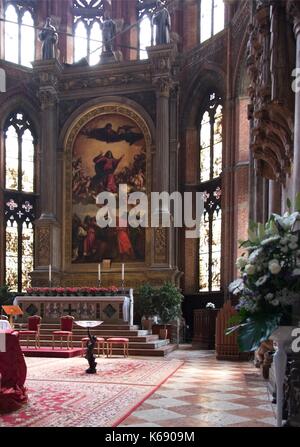 Venice Veneto Italy. Basilica Santa Maria Gloriosa dei Frari (I Frari). Presbytery altarpiece Assunta by Tiziano - Assumption of the Virgin by Titian  Stock Photo