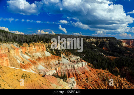 This is a view of the red rock formations and forested area of the amphitheater of Cedar Breaks National Monument, Utah, USA.