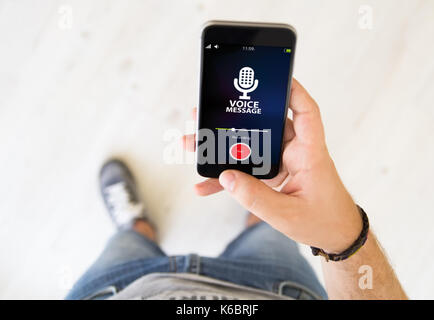 close up of male hand using voice message app smart phone Stock Photo